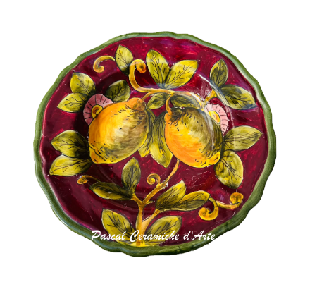 Hand-painted Italian ceramic wall plate with golden lemons, olive-green leaves and pink flowers on burgundy background