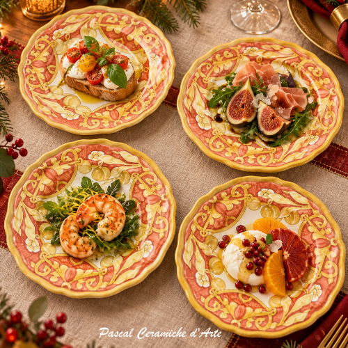 Four Monocromia Terracotta Italian ceramic appetizer plates styled on an elegant festive table with seasonal food